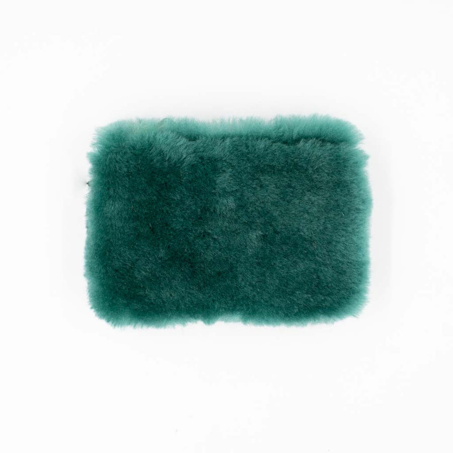 Coin pouch in a kelp colored shearling on white background