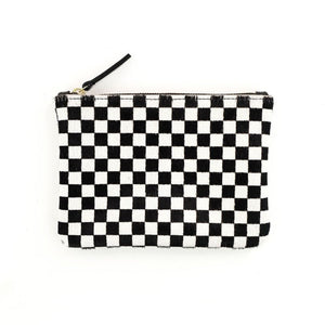 Black and white checkered zipper pouch with gold zipper and black leather zipper handle on white background