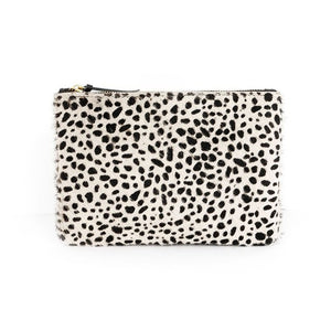 White cowhide zipper pouch with small, black spots. On a white background